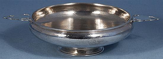 A George V Arts & Crafts silver bowl, by Albert Edward Jones, Diameter to handles 281mm, weight 9.8oz/305grms